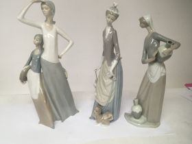Three large Lladro figures. Of ladies one with a d