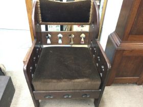 An arts and crafts styles chair. 58cm wide 58 deep