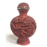 A Chinese Cinnabar style snuff bottle, approximate