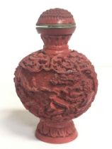 A Chinese Cinnabar style snuff bottle, approximate