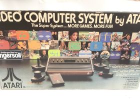 A Boxed Atari CX-2600 made in the U.S.A and a Coll