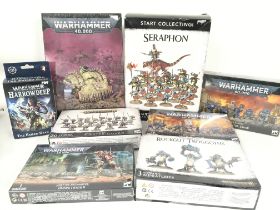 A Collection of Boxed Warhammer Figures.