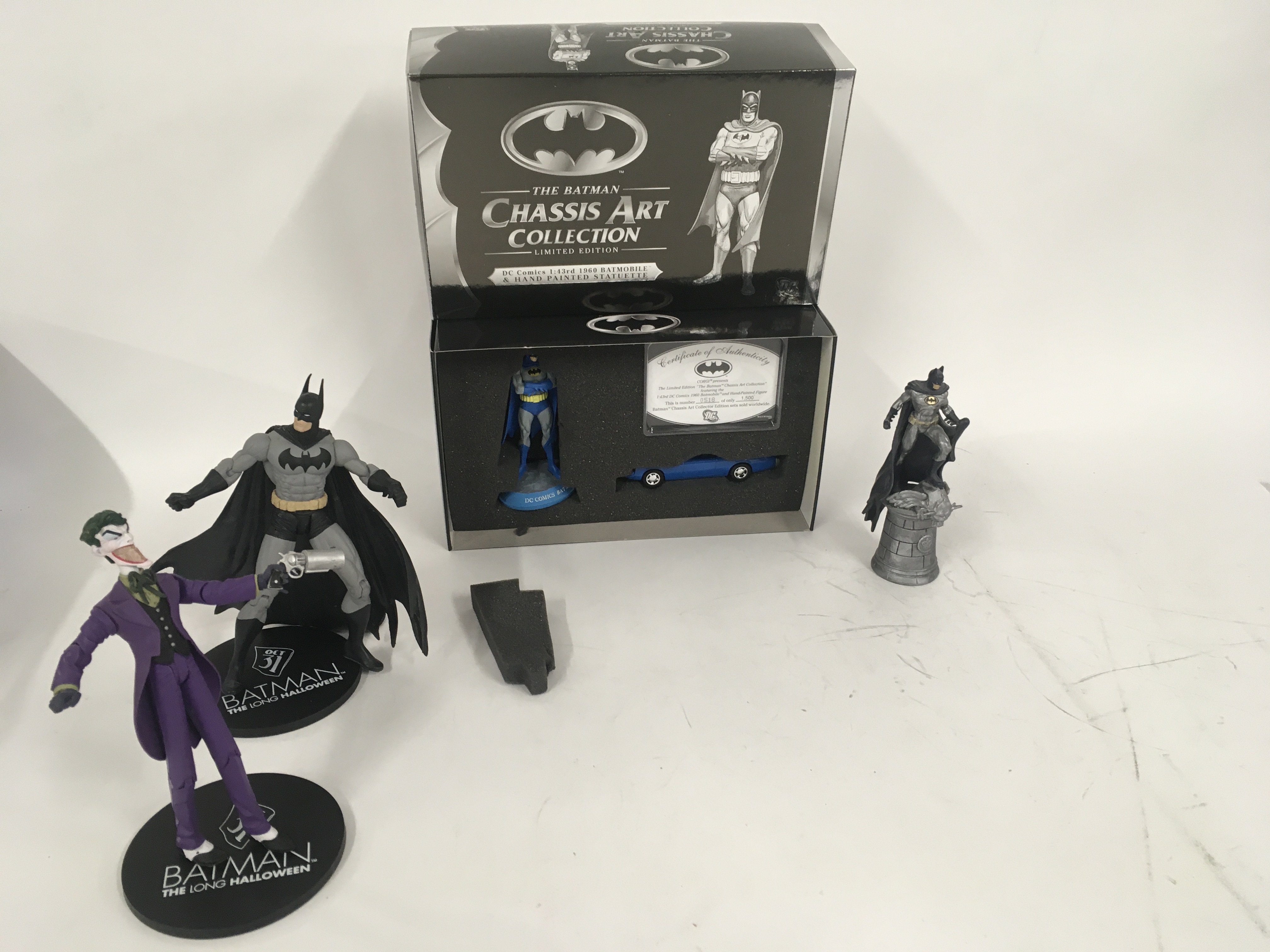 A collection of Batman figures including boxed lim