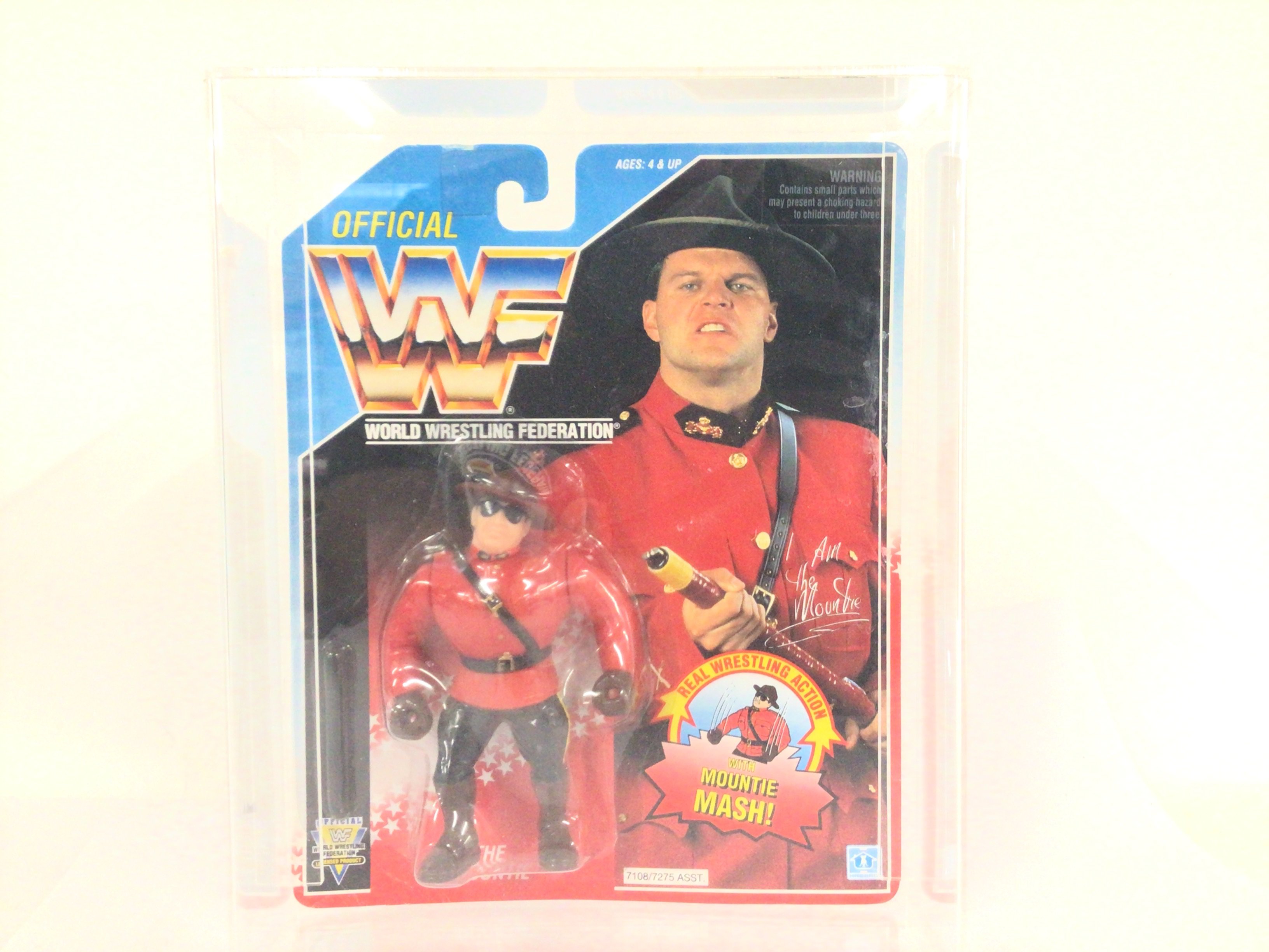 A Carded WWF The Mountie Figure With Cattle Prod. In Acrylic Case 1992. By Hasbro.