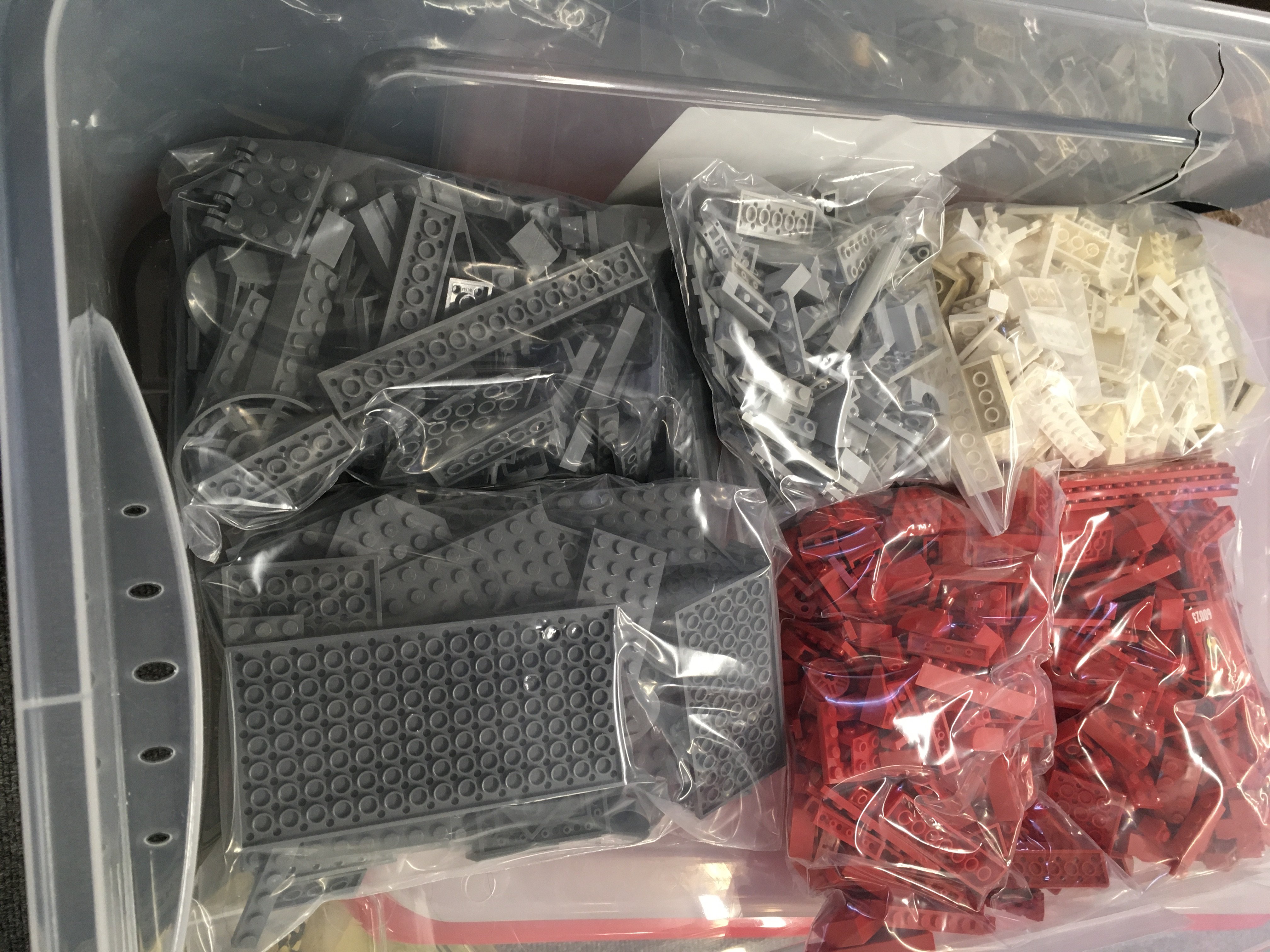 A large box containing 16 bags of assorted Lego pi