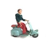 A Vintage Wind up toy of a Boys on a Motor Scooter