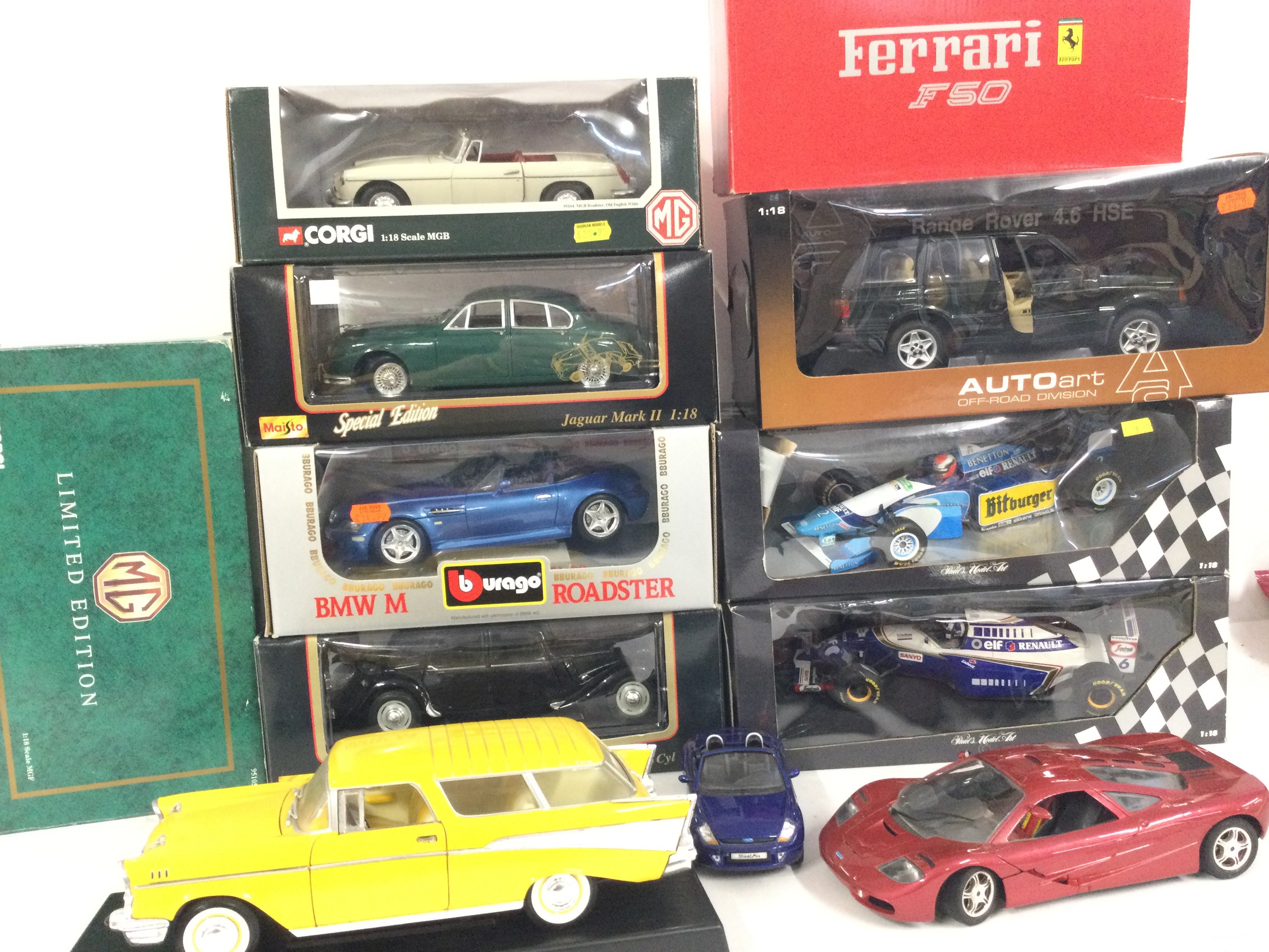A Collection of Boxed Diecast Vehicles including Burago. Maisto Corgi. All 1:18 Scale.
