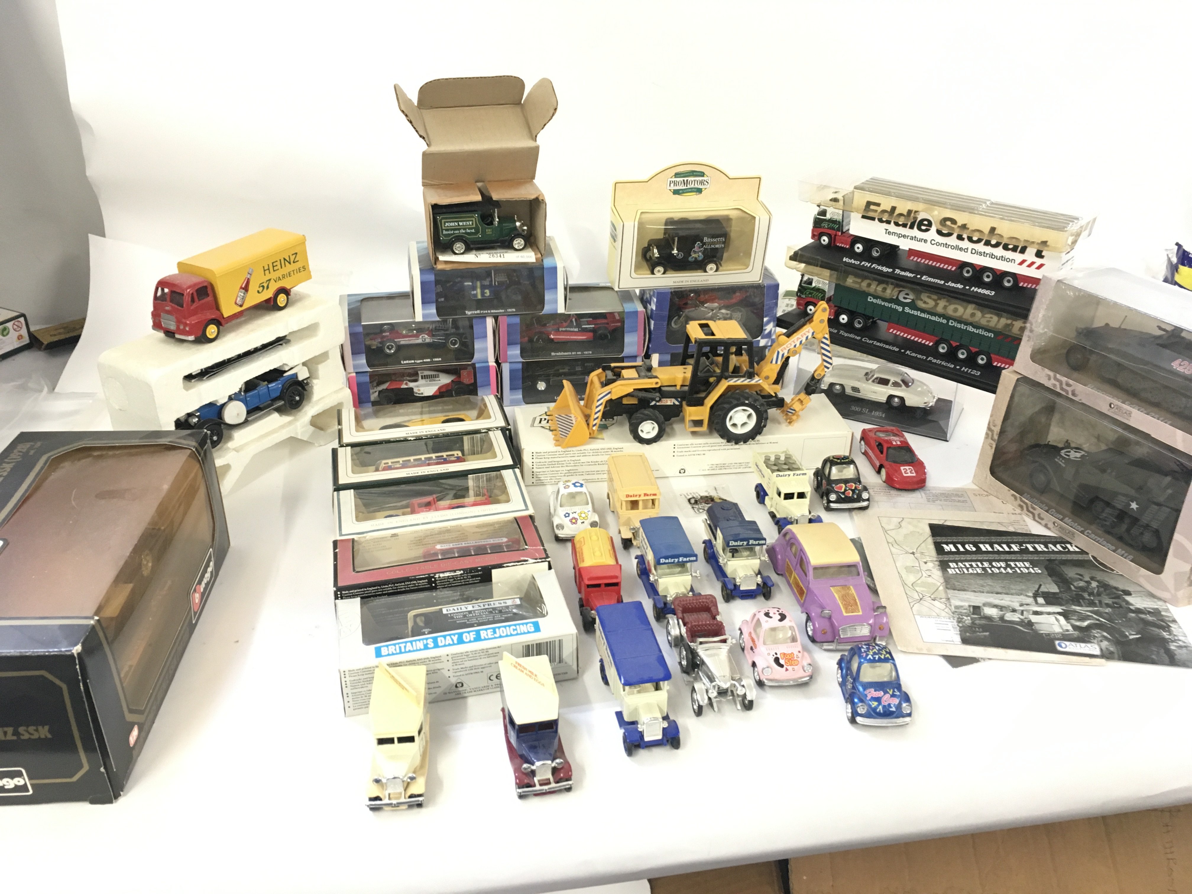 A collection of 20 boxed model vehicles and a furt