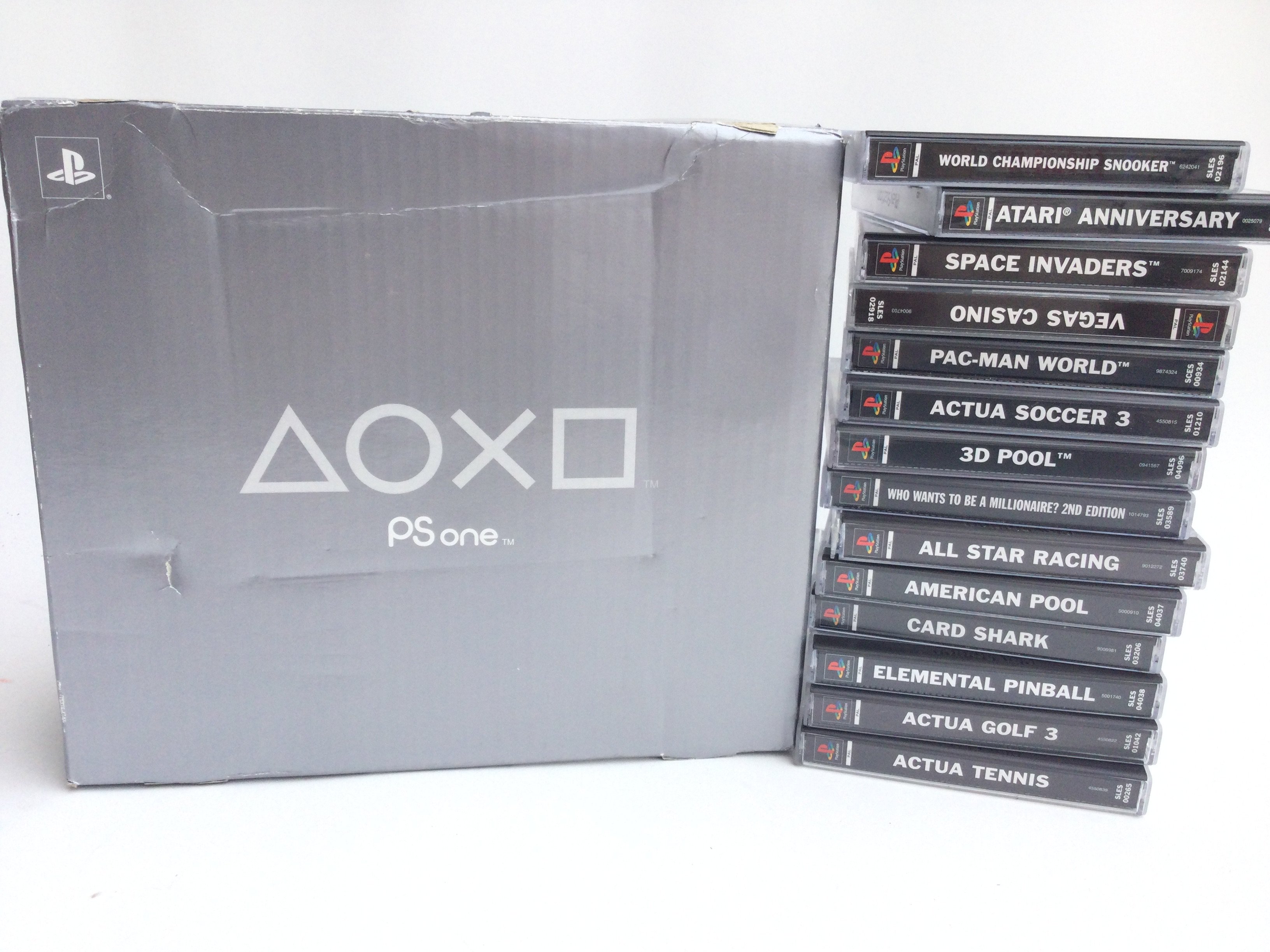 A Boxed Sony PlayStation 1 Slim and a collection o