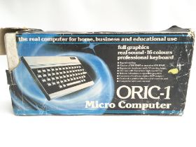 A Boxed Oris-1 Micro Computer and a Box Containing