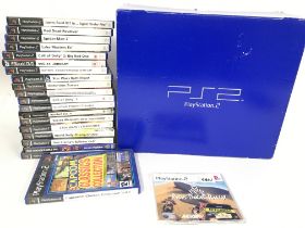 A Boxed Sony Playstation 2 with a Collection of Ga