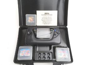 A Sega Game Gear In A Carry Case with 3 Games.