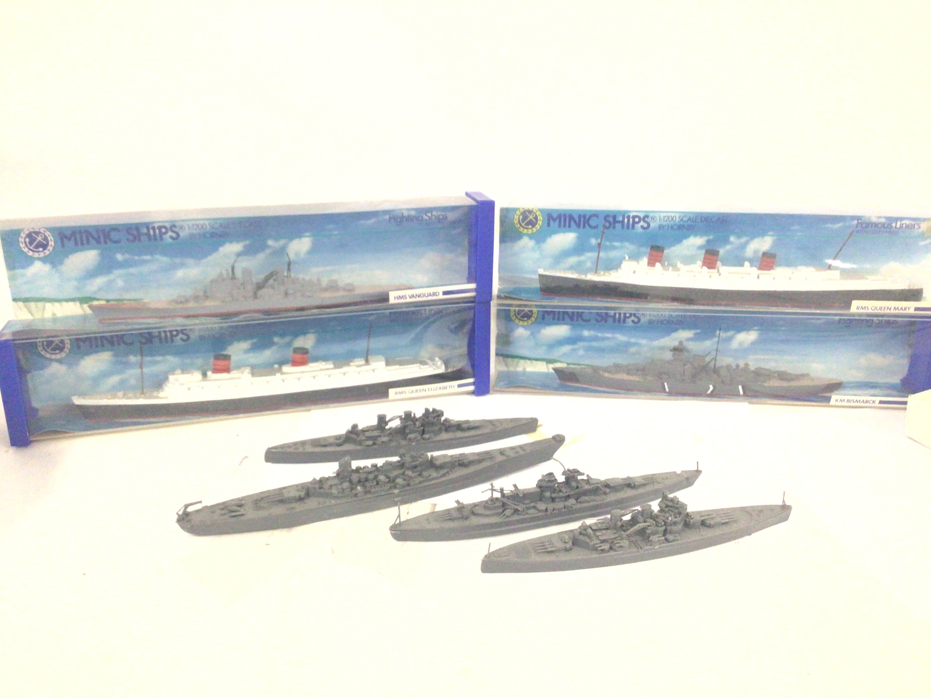 4 X Boxed Minic Ships and 4 plastic Ships. NO RESERVE