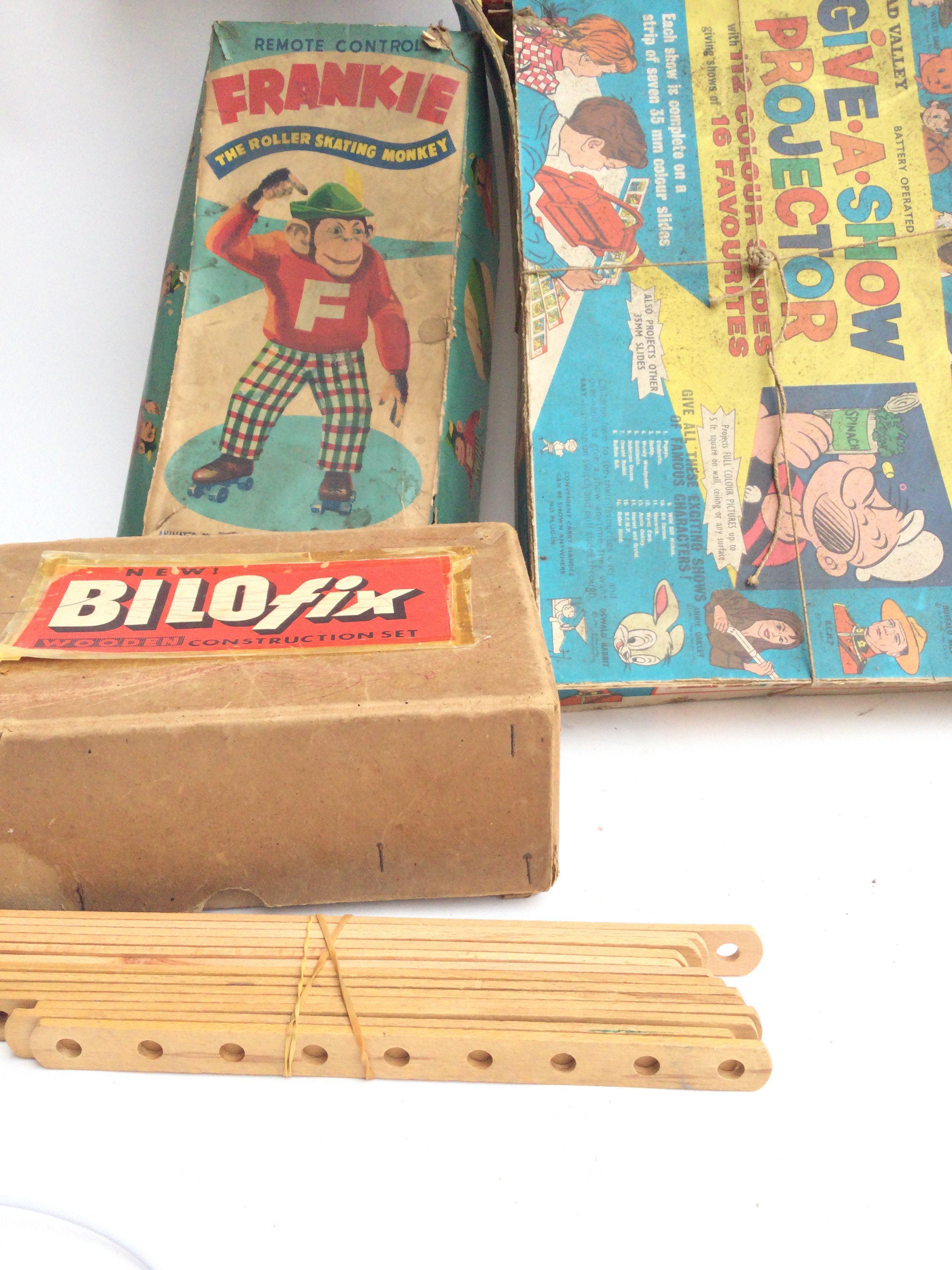 A Box Containing Vintage Toys and Puzzles includin