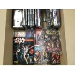 A Box Containing Star Wars Dvds. Vhs and Books. No
