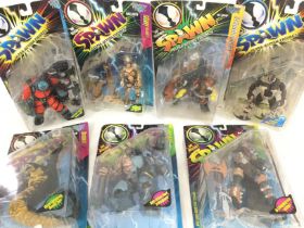 A Collection of Boxed Spawn Figures.