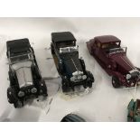 A collection of 11Collectable model cars by Franklin Mint. Corgi and others