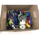 Box containing a number of assembled Lego models a