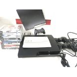 A Boxed Sony Playstation 3 with a Selection of Gam