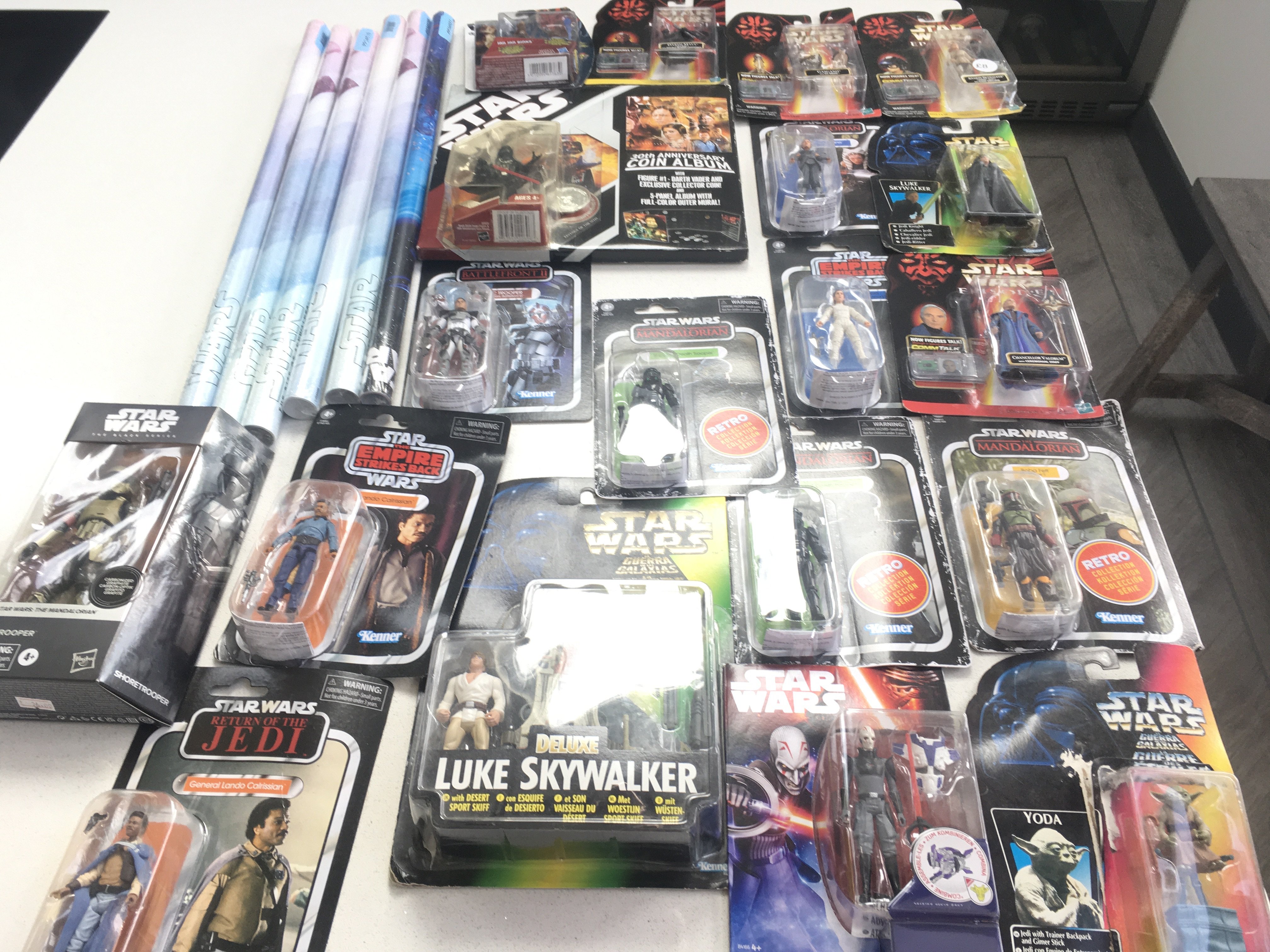 A collection in excess of 30 Star Wars pieces . In