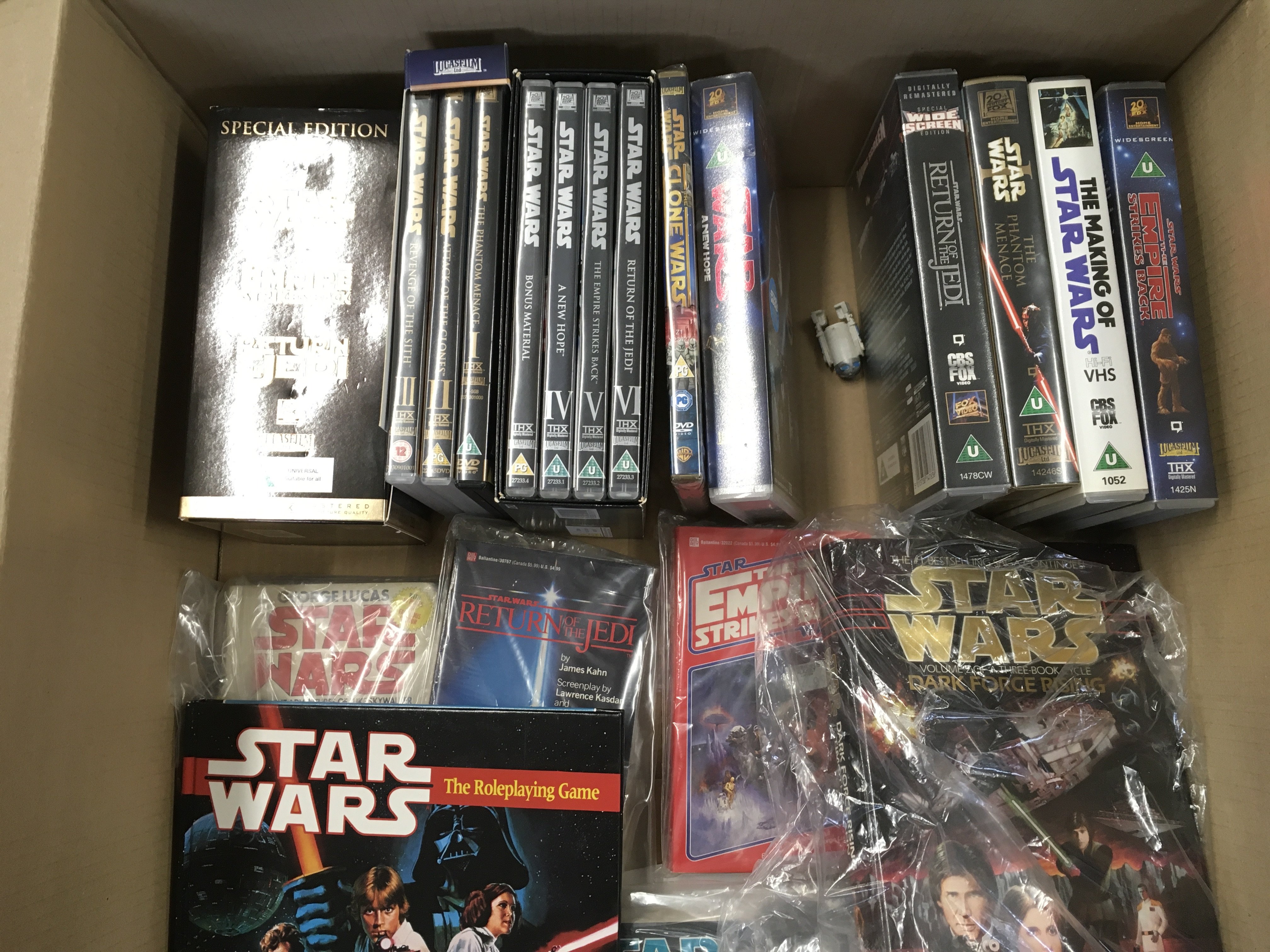 A Box Containing Star Wars Dvds. Vhs and Books. No - Image 2 of 3