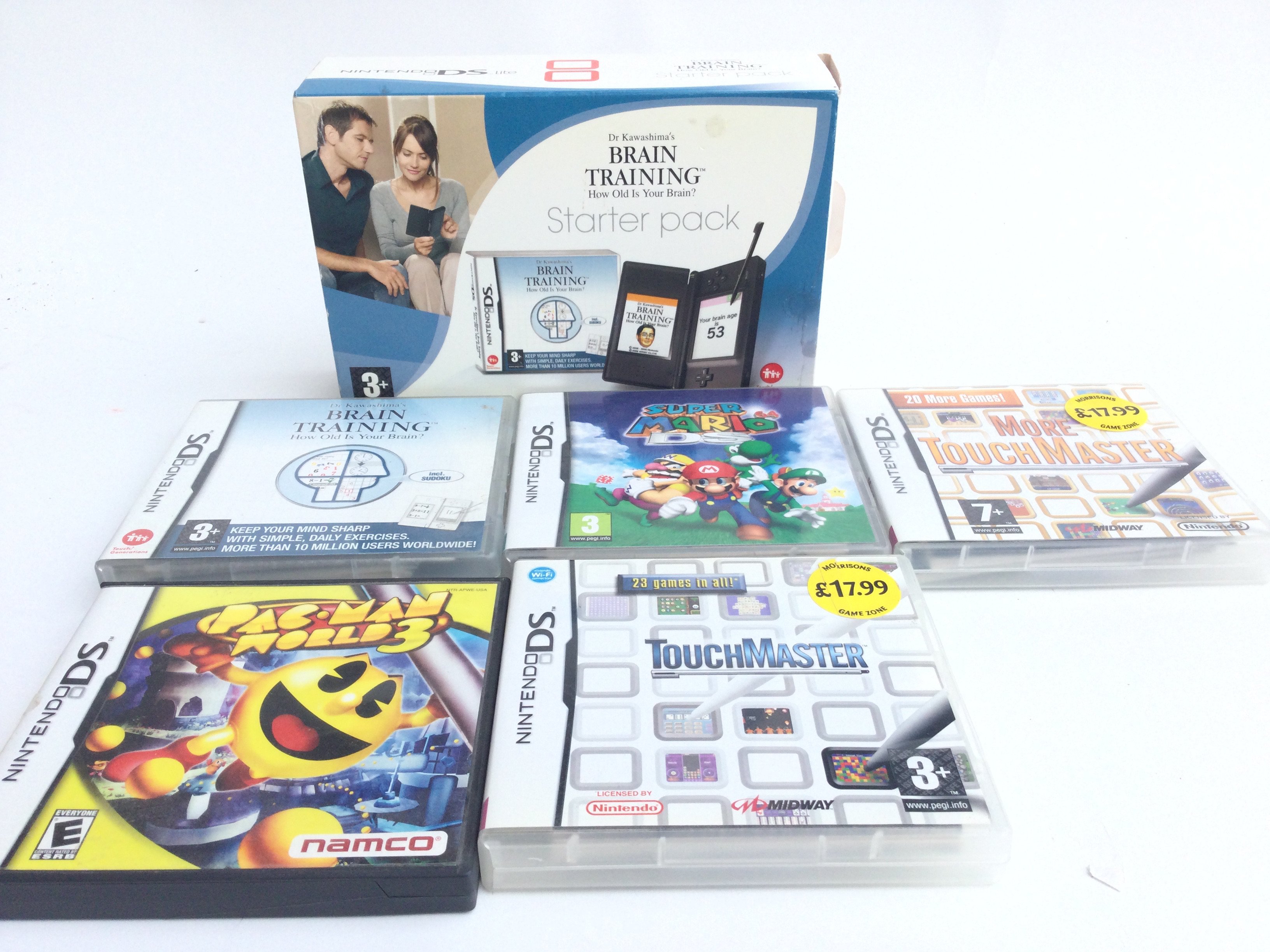 A Boxed Nintendo DS Light and 5 Games.