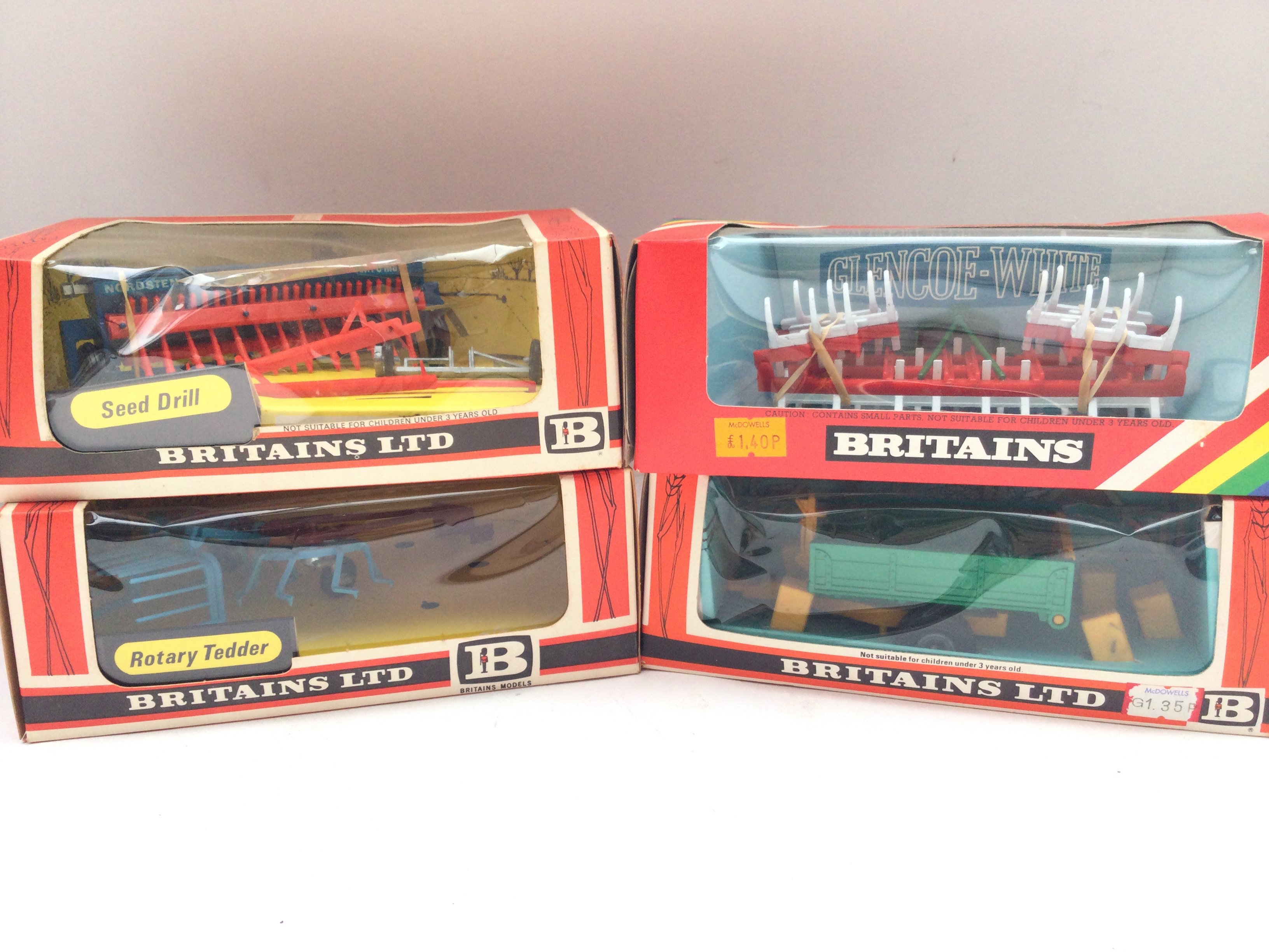 4 Boxed Britains Farming Implements. A Seed Drill