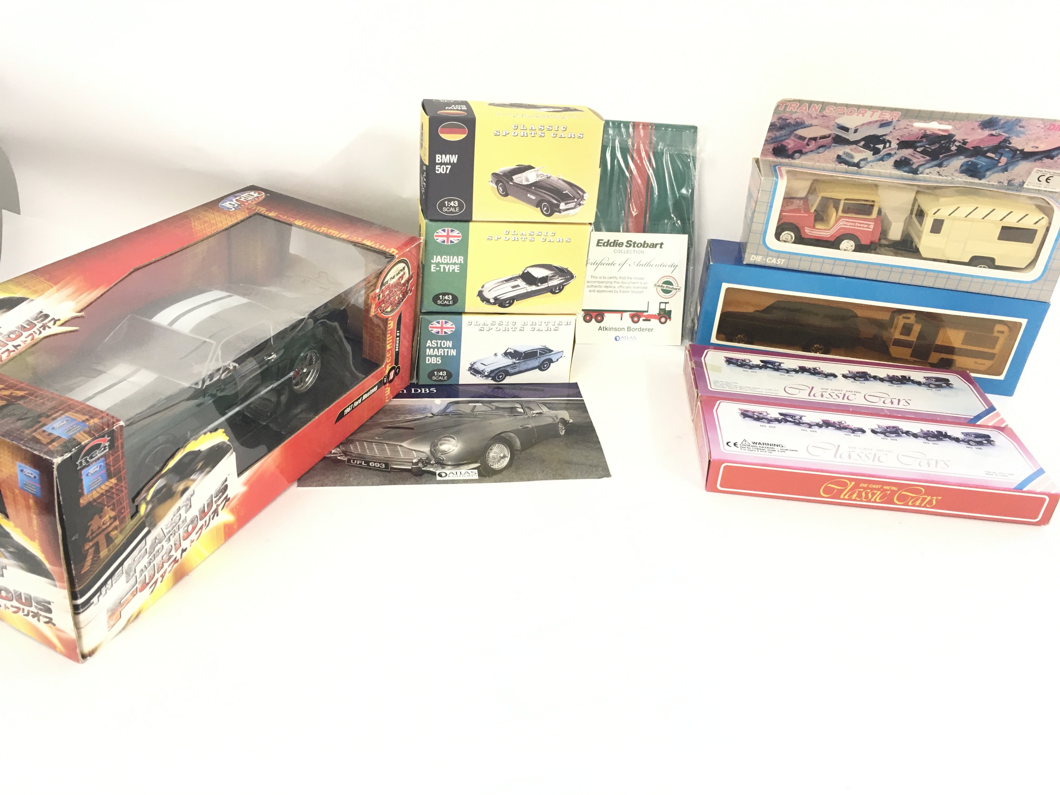 A collection of 8 boxed model cars by corgi etc