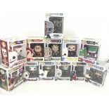 A collection of 12 boxed funko pop figures.