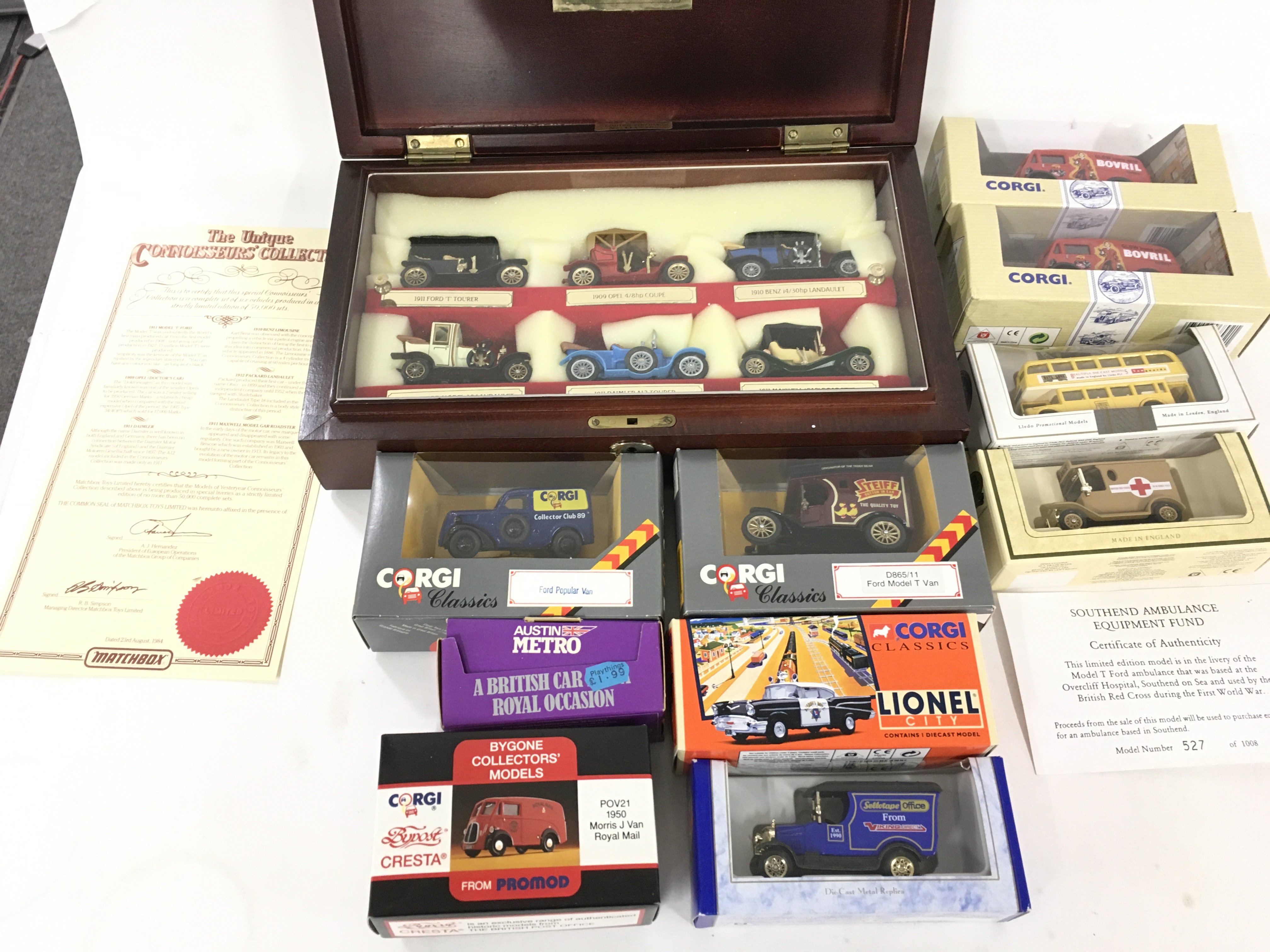 A collection of 10 unopened boxed vehicles by Corgi ..Lledo and others. Also contains a wooden