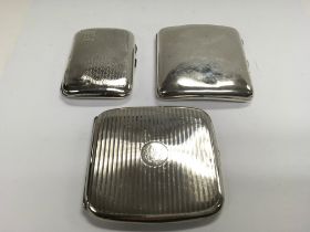 Three silver hallmarked cigarette cases. Approx 32