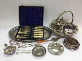 A collection of silver and silver plated items comprising a silver tazza, coasters, ashtrays,