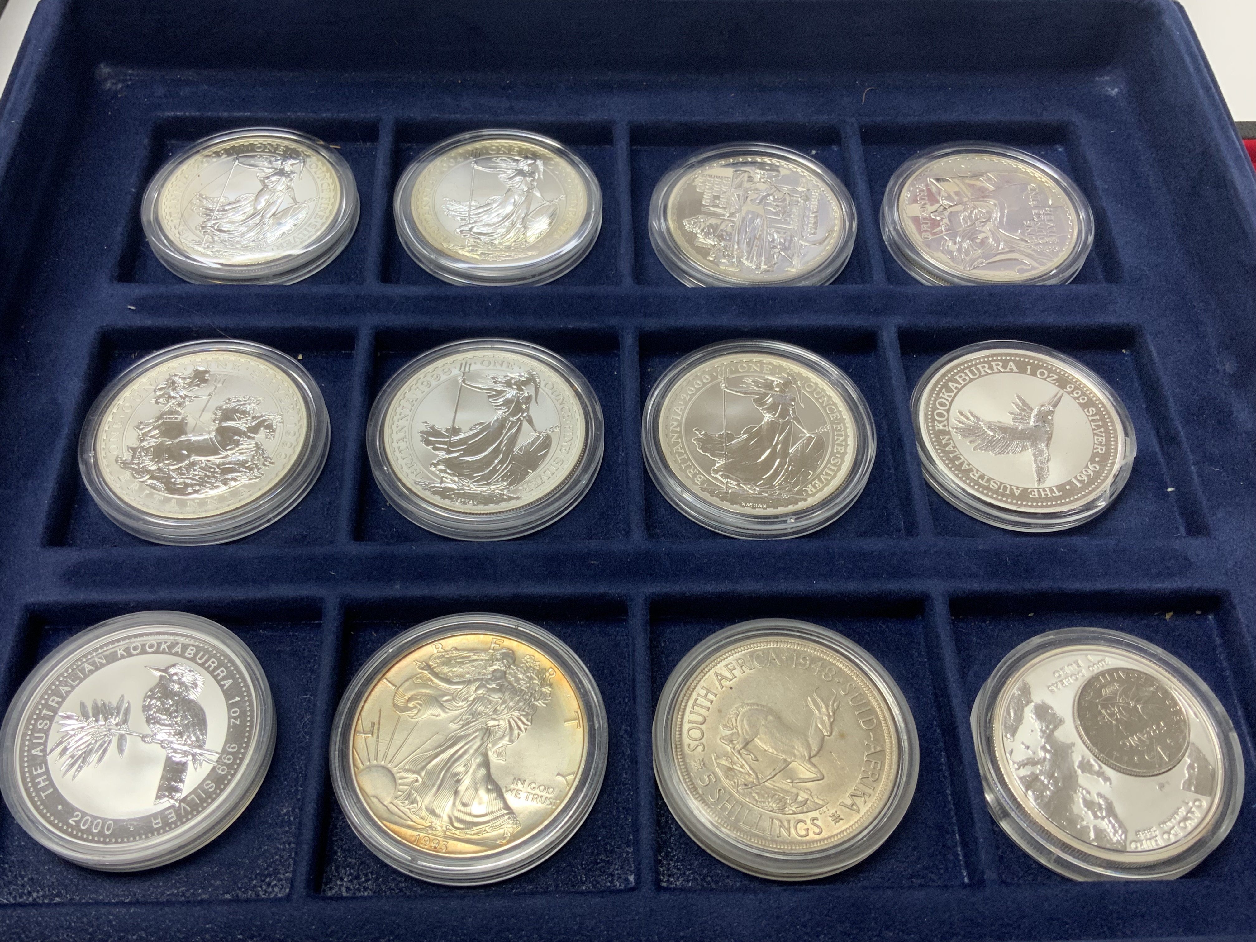 12 cased 1oz fine silver coins to include 7 Britta