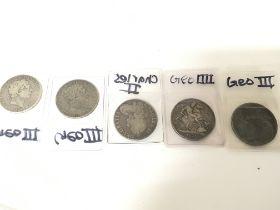 A collection of Georgian crowns and a Charles II c