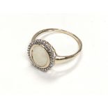 9ct yellow gold white opal and diamond ring, boxed