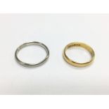 A 22ct gold band, approx 2.8g and an 18ct white go