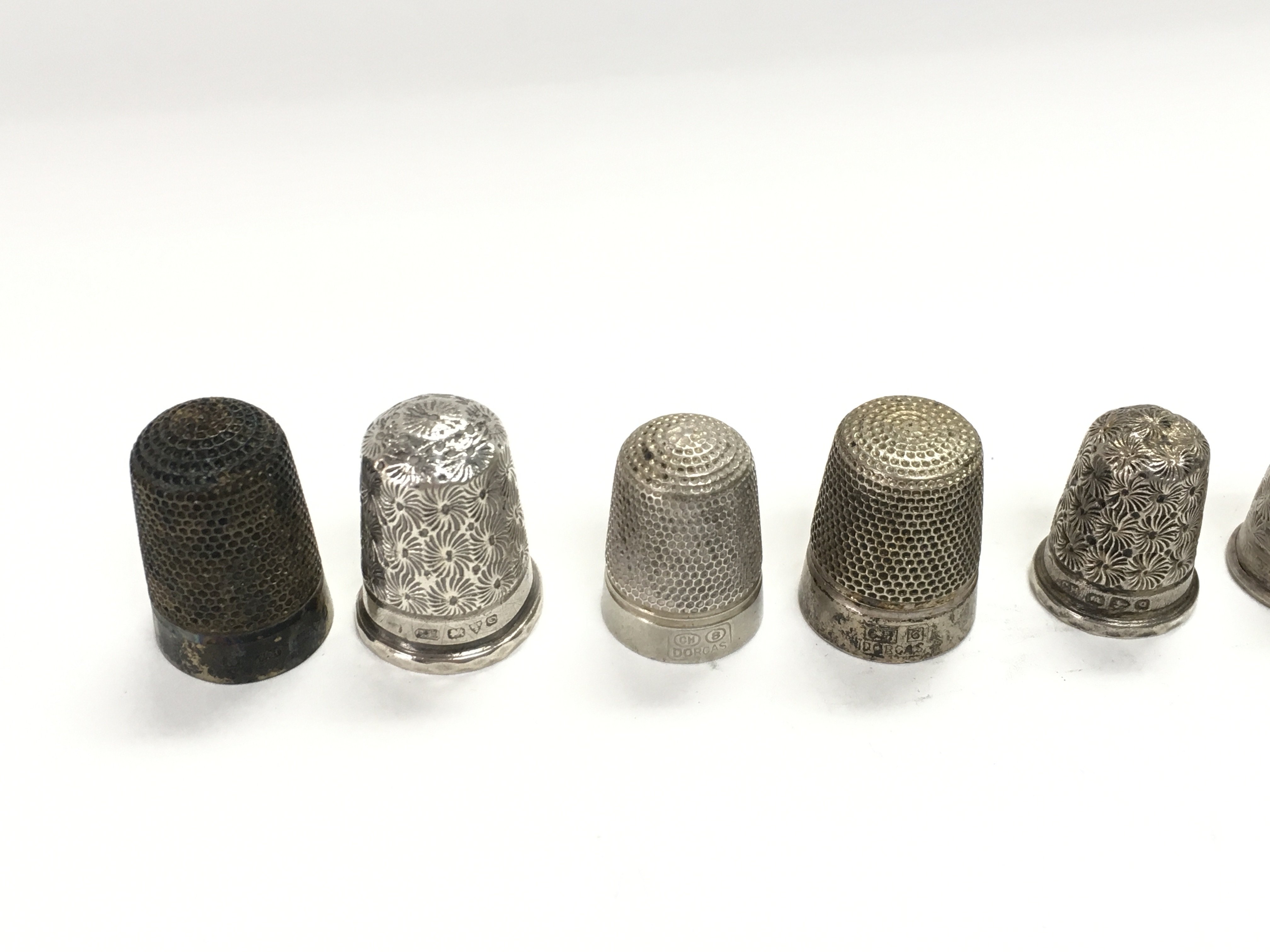 A collection of 12 Charles Horner silver thimbles. - Image 2 of 4