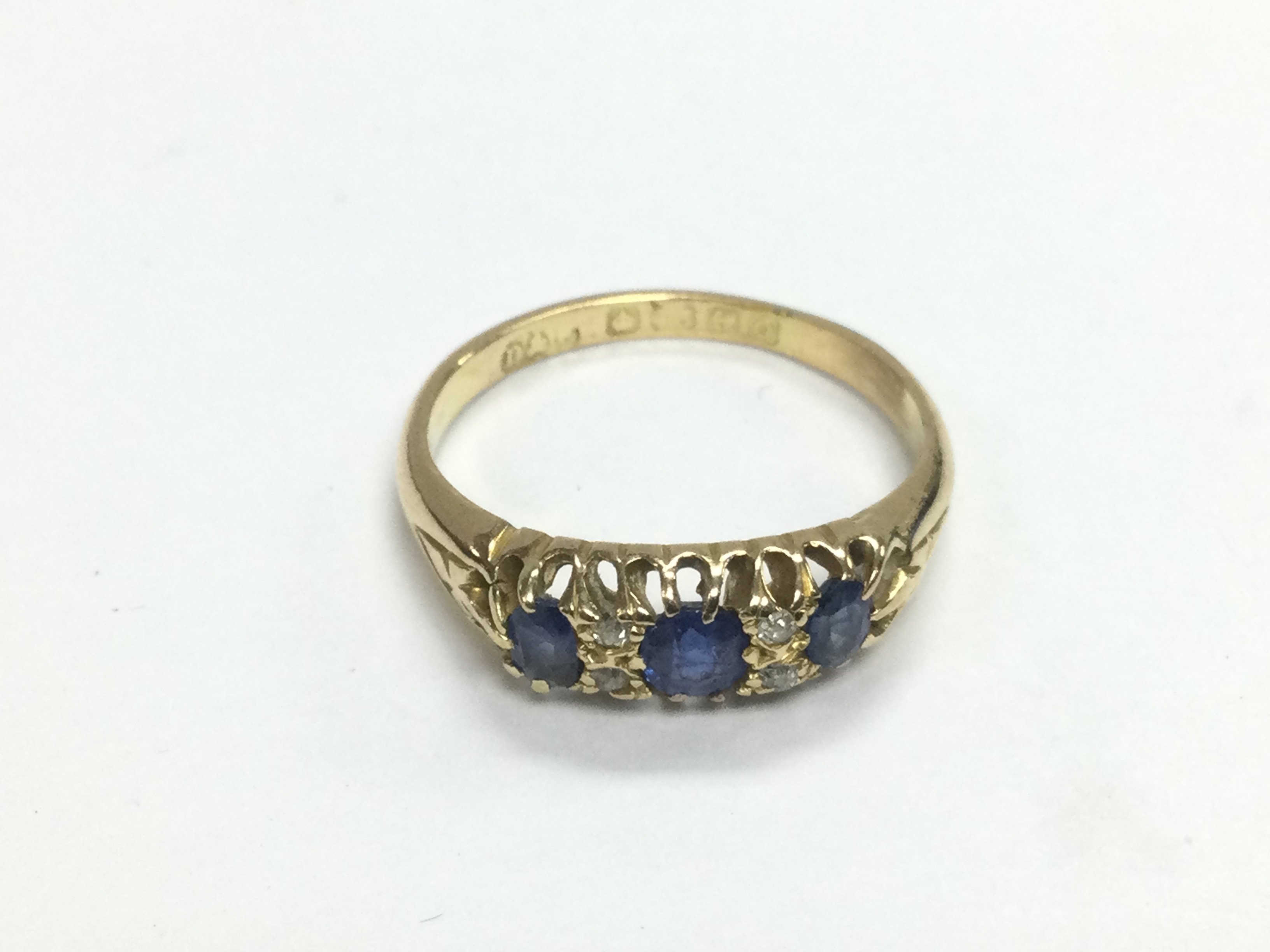 An 18ct gold, sapphire and diamond ring, approx 3g