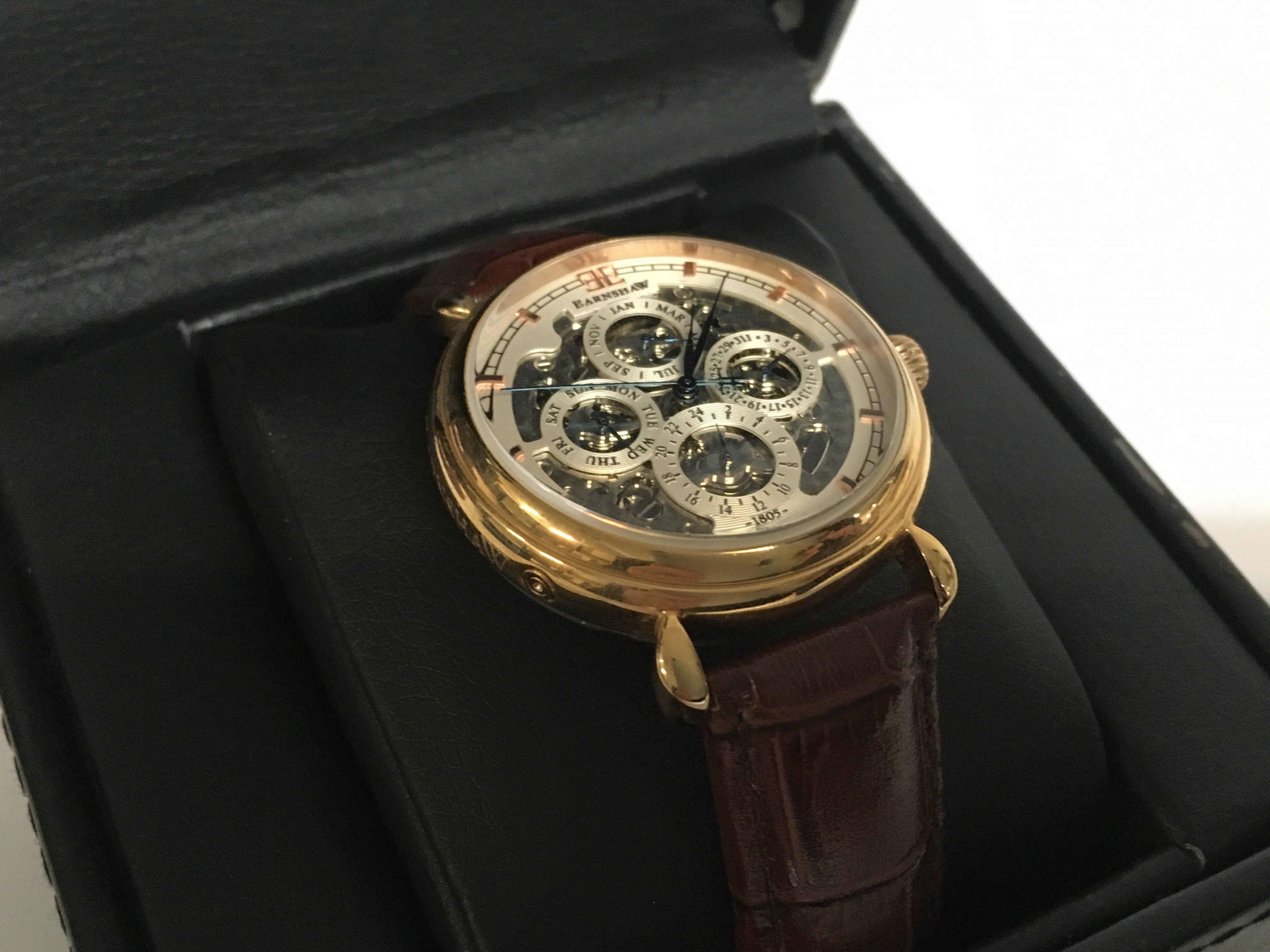 A boxed Earnshaw watch with skeleton movement. Pos
