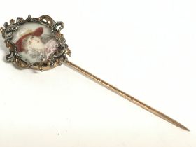 A miniature portrait stickpin. Postage category A