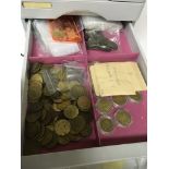 A plastic cabinet with five drawers containing an