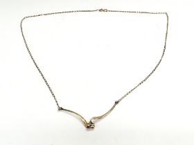 A 9ct gold and diamond set necklace. Approx 4g. Po