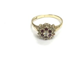 A 9ct gold ring set with ruby and diamond stones.