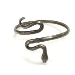 A silver snake bangle. Approx 7cm diameter and 17.