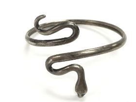 A silver snake bangle. Approx 7cm diameter and 17.