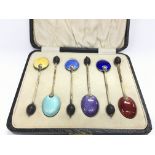 A boxed set of six enamelled spoons. Postage B
