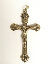 A 9ct gold cross pendant. Approximately 6cm long.