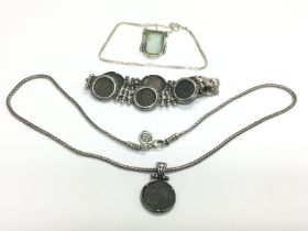 A Roman glass pendant on a silver chain plus a coi