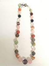 Antique beads including jade, coral, agate, quartz
