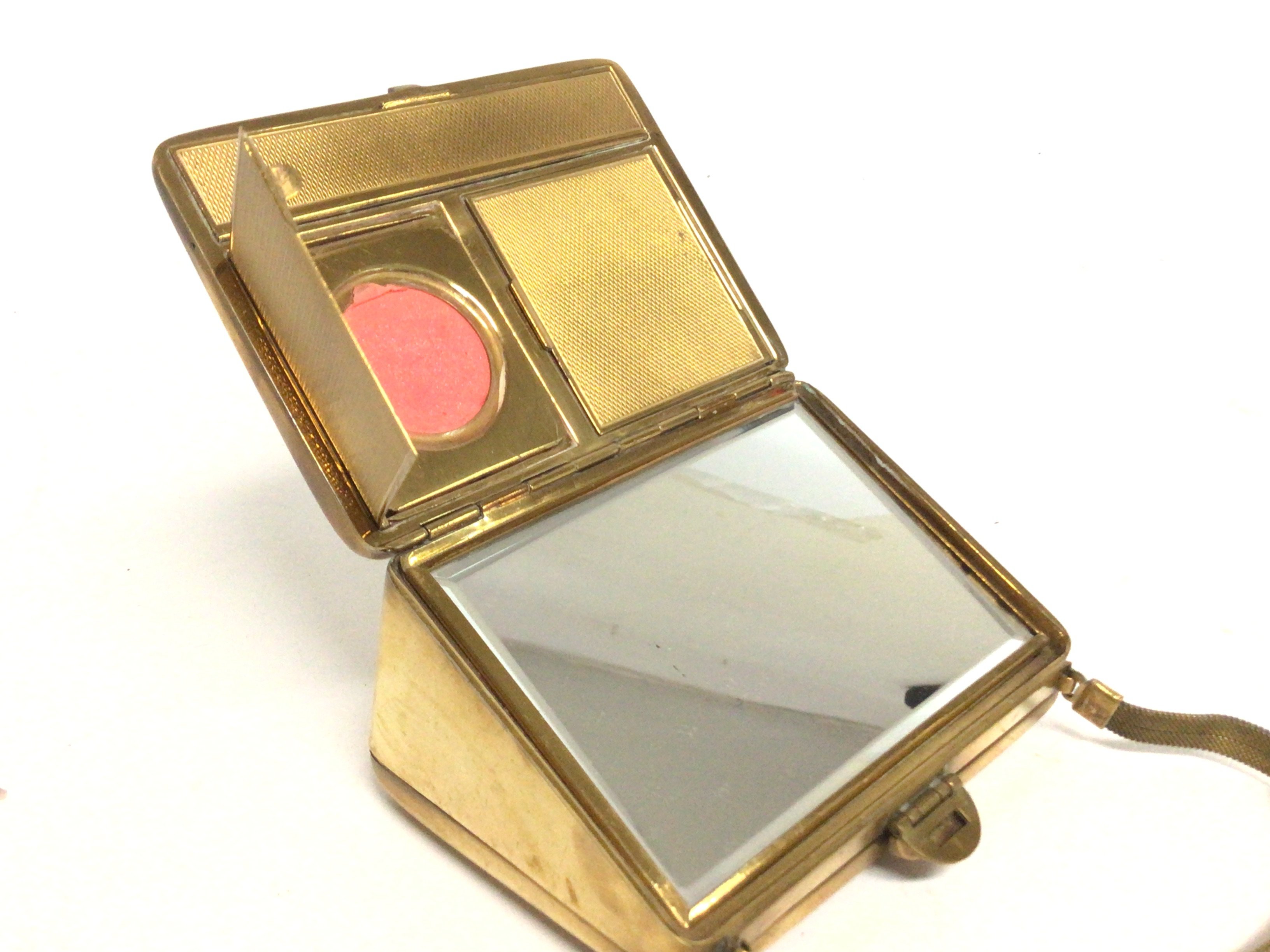 A vintage handbag design compact with makeup and a - Image 2 of 3